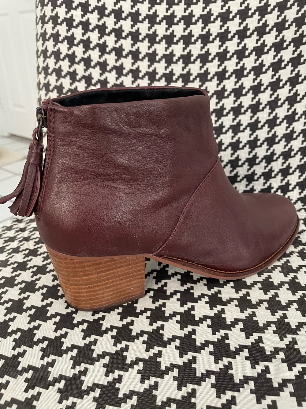TOMS women's oxblood bootie. Zip tassel back, 2-1/2" heel, rubber sole. 9 wide